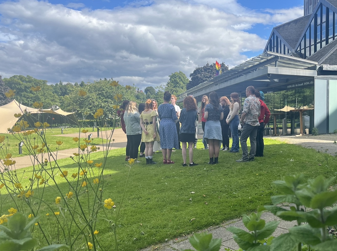 YSA standing in a circle outside Eden Court